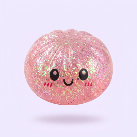 Dumplings Squishy Glitter -yllätyspakkaus puristettuna kädessä
