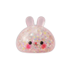 Bunny Dumpling Squishy Konfetti puristettuna kädessä