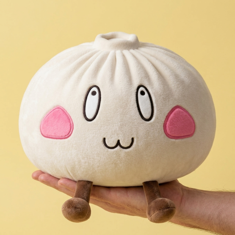 Squishy Dumpling Giant Iloinen Naama kädessä — kokovertailu