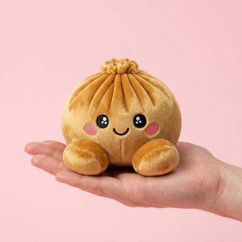 Squishy Dumpling Kuninkaallinen Kulta kädessä — kokovertailu